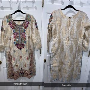 White dress with embroidered and mirror work.